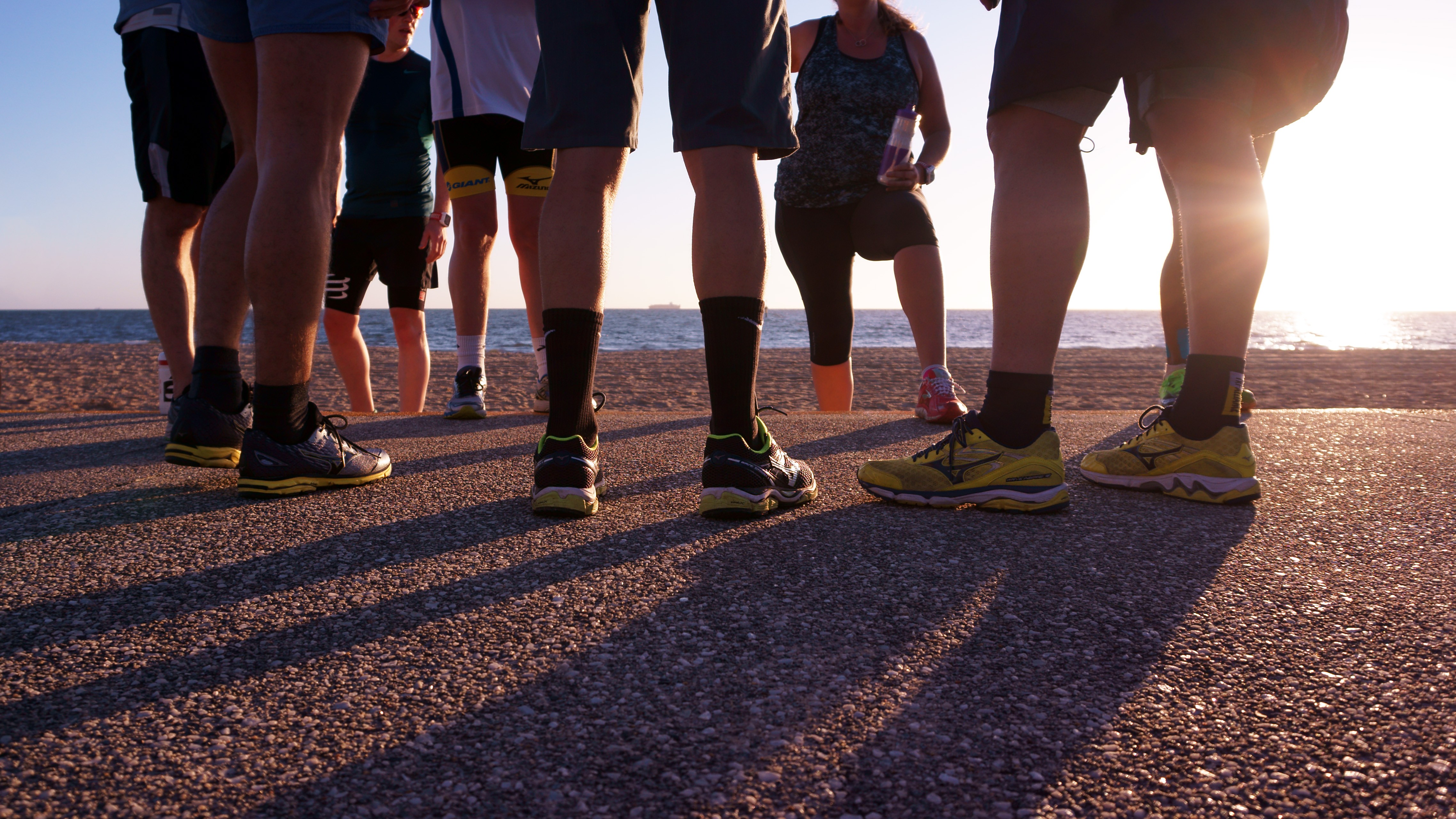 Tri Alliance athletes running together on the Melbourne coast